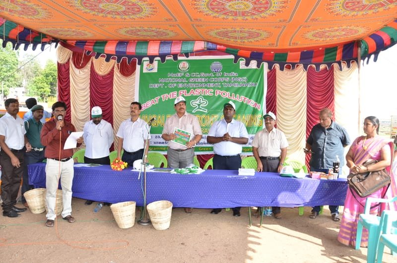 Riverfront restoration and waste sorting initiative in progress.